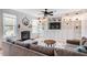 Spacious living room featuring built-in bookshelves, a fireplace, and lots of natural light at 91 Cliffdale Rd, Chapel Hill, NC 27516