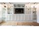 Bright living room showcasing built-in shelving, decorative lighting, and stylish decor at 91 Cliffdale Rd, Chapel Hill, NC 27516