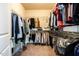Walk-in closet with organized storage, offering ample space for clothes, shoes, and personal belongings at 91 Cliffdale Rd, Chapel Hill, NC 27516