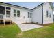 Backyard of home featuring newly installed patio and stairs leading to the home at 928 Lily Claire Ln, Fuquay Varina, NC 27526