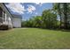 The sprawling backyard showcases a pristine lawn with plenty of space for outdoor enjoyment at 928 Lily Claire Ln, Fuquay Varina, NC 27526
