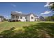 Expansive backyard showing the back exterior of the home at 928 Lily Claire Ln, Fuquay Varina, NC 27526