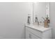 Modern bathroom featuring a quartz countertop, white cabinetry, and stylish fixtures at 928 Lily Claire Ln, Fuquay Varina, NC 27526