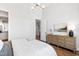 Bright bedroom with chandelier featuring hardwood floors and view of bathroom at 928 Lily Claire Ln, Fuquay Varina, NC 27526