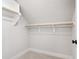 Walk-in closet featuring ample shelf space and carpeting at 928 Lily Claire Ln, Fuquay Varina, NC 27526