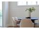 Close-up of bright dining area with shiplap and view to backyard at 928 Lily Claire Ln, Fuquay Varina, NC 27526