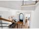 Entryway featuring hardwood floors, modern railing, and a stylish light fixture at 928 Lily Claire Ln, Fuquay Varina, NC 27526