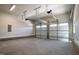 Spacious and well-lit three-car garage with ample room for parking and storage at 928 Lily Claire Ln, Fuquay Varina, NC 27526