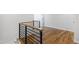 Hallway with modern railings and hardwood floors at 928 Lily Claire Ln, Fuquay Varina, NC 27526