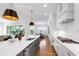 Bright kitchen features a gray island with white countertops and stylish pendant lighting at 928 Lily Claire Ln, Fuquay Varina, NC 27526