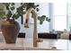 Close-up of a kitchen island featuring a modern faucet and stylish botanical arrangement at 928 Lily Claire Ln, Fuquay Varina, NC 27526