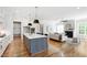 Open-concept kitchen flowing into the living room, ideal for entertaining and gatherings at 928 Lily Claire Ln, Fuquay Varina, NC 27526