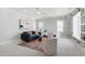 Stylish living room with soft carpeting, built-in shelves and a comfortable sofa at 928 Lily Claire Ln, Fuquay Varina, NC 27526