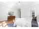 Bright main bedroom with hardwood floors, dresser, and ceiling fan at 928 Lily Claire Ln, Fuquay Varina, NC 27526