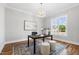 Bright office with large window, stylish rug and modern light fixture at 928 Lily Claire Ln, Fuquay Varina, NC 27526