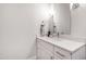 Powder room featuring a vanity with granite countertops, updated fixtures, and modern lighting at 928 Lily Claire Ln, Fuquay Varina, NC 27526