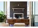 Close up of screened porch fireplace with seating and decor, offering a relaxing outdoor ambiance at 928 Lily Claire Ln, Fuquay Varina, NC 27526