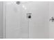 Contemporary shower with white subway tile, glass door, and a built-in niche at 928 Lily Claire Ln, Fuquay Varina, NC 27526