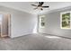 Spacious bedroom with neutral carpet, crown molding and two windows for natural light at 9391 Turkey Way, Middlesex, NC 27557