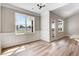 Bright dining room with wainscoting features large windows and wood floors at 9391 Turkey Way, Middlesex, NC 27557
