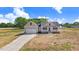Charming single-Gathering home boasts a manicured lawn and attached two-car garage at 9391 Turkey Way, Middlesex, NC 27557