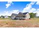 New construction single-Gathering home with a porch and a spacious front yard at 9391 Turkey Way, Middlesex, NC 27557