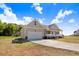 New construction single-Gathering home with attached garage, porch, and concrete driveway at 9391 Turkey Way, Middlesex, NC 27557