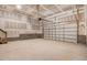 Spacious garage with concrete block foundation, overhead lighting, and insulated garage door at 9391 Turkey Way, Middlesex, NC 27557