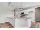 Kitchen island with pendant lighting, granite countertops, and stainless steel appliances at 9391 Turkey Way, Middlesex, NC 27557