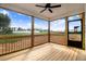Covered porch with wood railing and flooring, great for outdoor relaxation with a view at 9391 Turkey Way, Middlesex, NC 27557