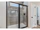 Walk-in shower with gray subway tile, glass door, and modern fixtures at 9391 Turkey Way, Middlesex, NC 27557
