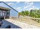 Wooden deck with railings overlooking a green backyard, perfect for outdoor entertainment at 101 Becklow Ridge Lane Ln, Holly Springs, NC 27540