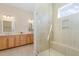 Light-filled bathroom with double vanity, frameless glass shower, and contemporary tile at 101 Becklow Ridge Lane Ln, Holly Springs, NC 27540