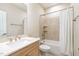 Well-lit bathroom featuring a shower-tub combination and vanity with a stone countertop at 101 Becklow Ridge Lane Ln, Holly Springs, NC 27540