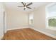 Bedroom features two windows for natural light and hardwood flooring at 101 Becklow Ridge Lane Ln, Holly Springs, NC 27540