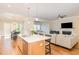 Spacious kitchen flows to a dining area and living space, great for entertaining guests at 101 Becklow Ridge Lane Ln, Holly Springs, NC 27540