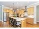 Kitchen with stainless steel appliances, ample cabinets, and a large island with seating at 101 Becklow Ridge Lane Ln, Holly Springs, NC 27540