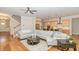 Open living space featuring hardwood floors, a modern kitchen, and a cozy seating area at 101 Becklow Ridge Lane Ln, Holly Springs, NC 27540