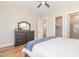 Main bedroom featuring hardwood floors, a closet, and an attached bath at 101 Becklow Ridge Lane Ln, Holly Springs, NC 27540