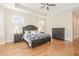 Bright main bedroom showcases hardwood floors and a beautiful furniture set at 101 Becklow Ridge Lane Ln, Holly Springs, NC 27540