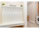 Mudroom with coat rack and welcome sign, offering a transition space from outdoors at 101 Becklow Ridge Lane Ln, Holly Springs, NC 27540