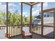 Cozy screened porch with comfortable seating, ideal for relaxation and enjoying the outdoors at 101 Becklow Ridge Lane Ln, Holly Springs, NC 27540