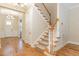 Elegant staircase featuring wood and carpet design, complemented by natural light at 101 Becklow Ridge Lane Ln, Holly Springs, NC 27540
