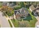 Aerial view of a stately brick home with manicured lawn and mature trees at 101 Silk Leaf, Cary, NC 27518