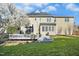 Expansive backyard with a well-maintained lawn, and a charming gray deck at 101 Silk Leaf, Cary, NC 27518