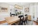 Lovely dining space with stylish furnishings, chandelier lighting, and views into the foyer at 101 Silk Leaf, Cary, NC 27518