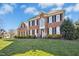 Attractive brick residence boasts manicured landscaping and a well-maintained lawn on a sunny day at 101 Silk Leaf, Cary, NC 27518