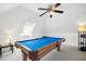 Finished attic game room with a pool table, carpet floors, and neutral paint throughout at 101 Silk Leaf, Cary, NC 27518