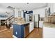 Spacious kitchen featuring granite counters, a large island, and stainless steel appliances at 101 Silk Leaf, Cary, NC 27518
