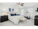 Serene bedroom with a queen-sized bed, ceiling fan, and natural light from the windows at 101 Silk Leaf, Cary, NC 27518